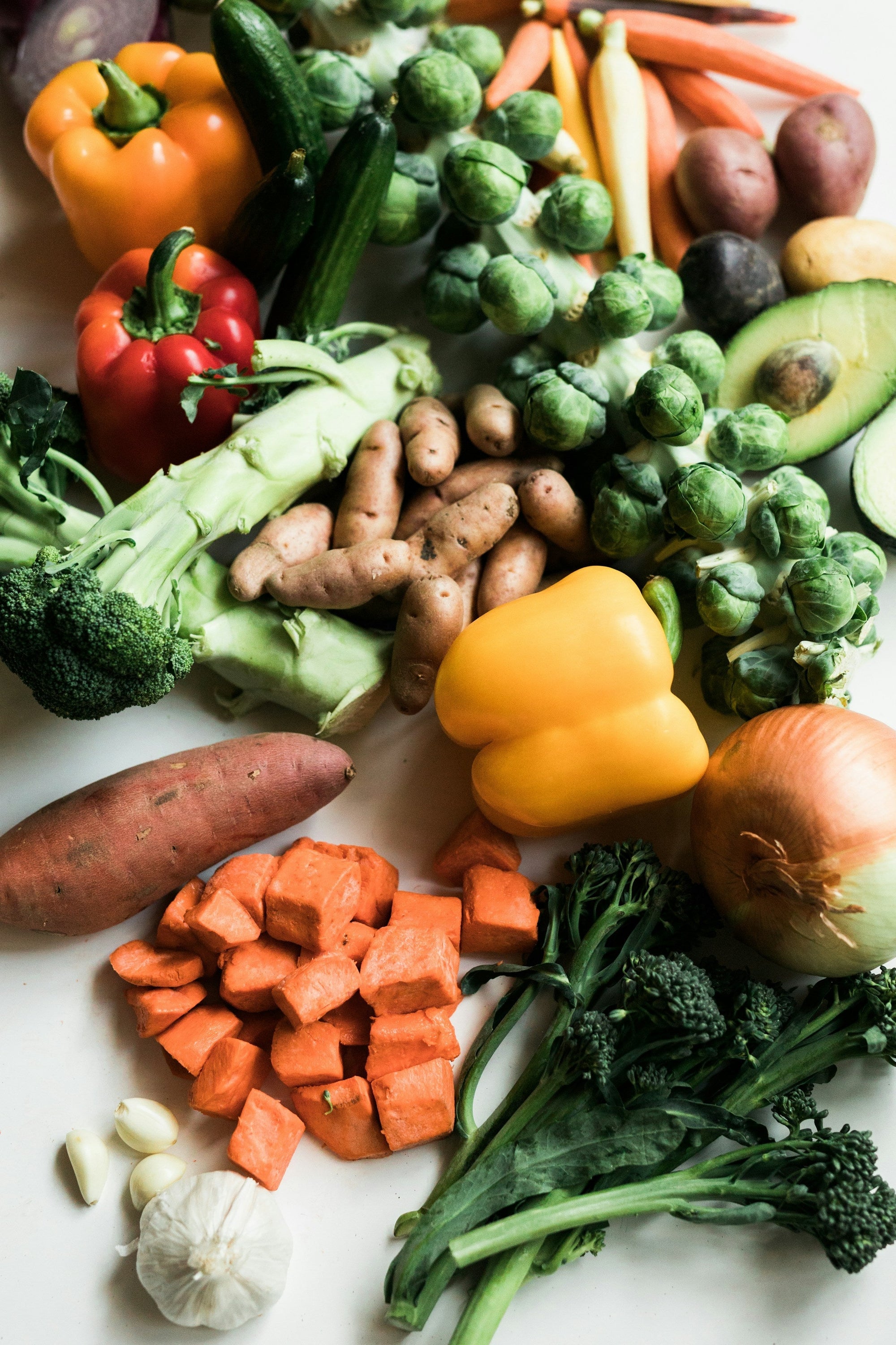 Sliced carrots and leafy greens — Low FODMAP vegetables safe for acid reflux and IBS dietary management&nbsp;